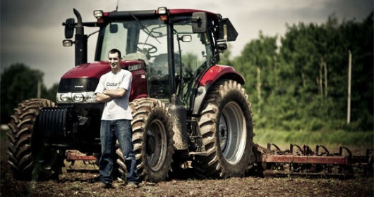Matthew Rankin, Class of 2013, with one of the CASE IH tractors.