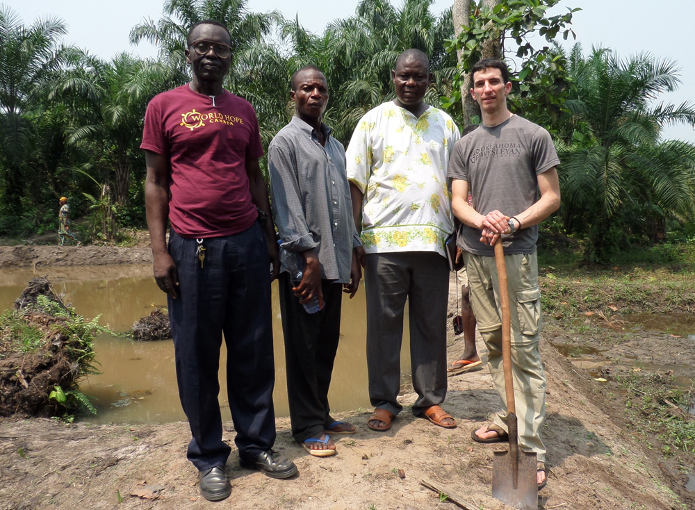 Peter Corey (right) with farmers in the Congo
