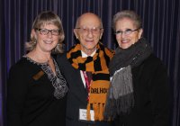 Gregory Neiman (MD'48) and his wife Evelyne smile for a photo with Ann Vessey, Development Officer at Dal