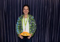 Monica Giacomin (BPE'80) holds a Dal football for the photo booth