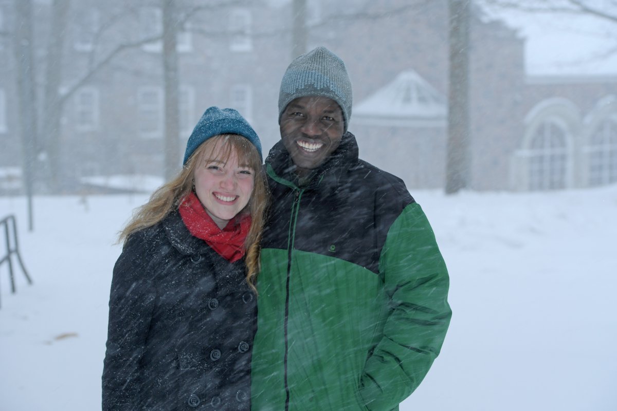 Emma Cruddas and Luka Igali enjoy a snowy day on campus.