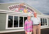 Priscilla and Eric Jennings in front of the iconic Masstown Market. (Provided photos)