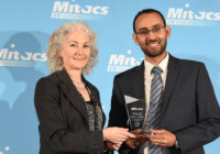 Dr. Al-Hamdani receives his award from Bonnie Schmidt, founder and president of Let’s Talk Science. (Mitacs photo)