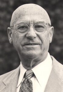 A black and white photo of Dr. Carl Pearlman