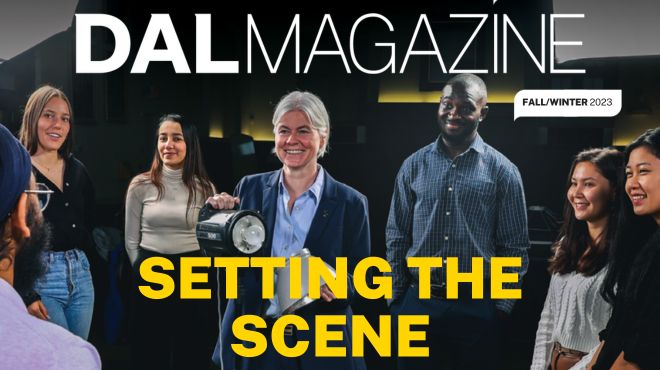 The cover of Dal Magazine Fall/Winter 2023 with Kim Brooks holding a spotlight among a group of students.